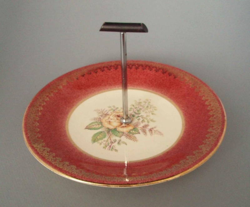 Cake plate and handle - floral; Crown Lynn Potteries Limited; 1950-1970; 2008.1.559.1-2