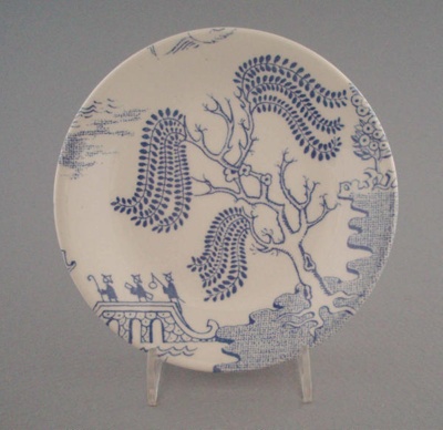 Butter pat - Willow pattern; Crown Lynn Potteries Limited; 1968-1980; 2008.1.1947