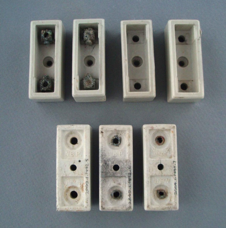 Oven fuse housings - A.B.P.; Crown Lynn Technical Ceramics Limited; 1940-1980; 2009.1.1492.1-7