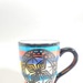 Mug - trial for Kap Kap and Koru pattern on Zoop background; Studio Ceramics NZ Ltd; 2002; 2017.1.110
