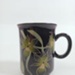 Mug - Black with Green Orchids; Crown Lynn Potteries Limited; 1980s; 2016.48.30