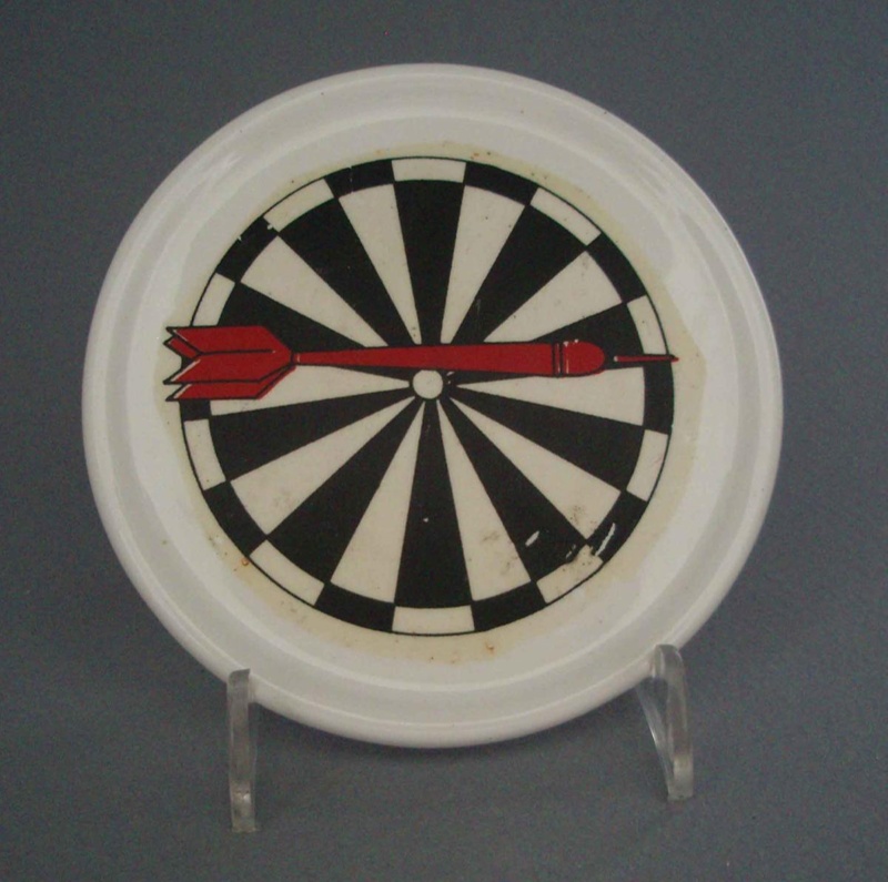 Coaster - darts; Crown Lynn Potteries Limited; 1988-1989; 2008.1.2630