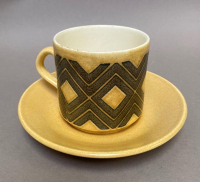 Cup with geometric design and matching saucer.; Crown Lynn Potteries Limited; 1970s; 2016.48.81