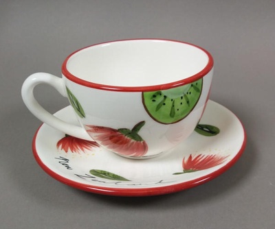 Cup and saucer - kiwifruit and pohutukawa; Studio Ceramics NZ Ltd; 1991-2017; 2017.1.5