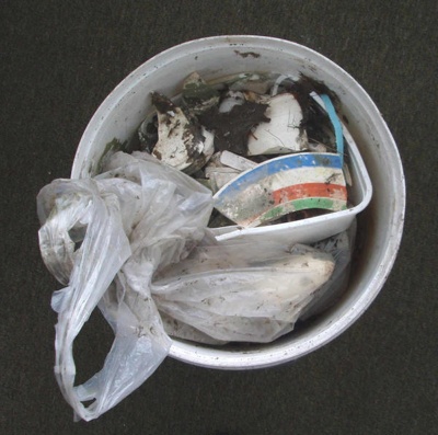 Bucket of objects dug from former Crown Lynn site; Crown Lynn Potteries Limited; 1940-1980; 2009.1.1668
