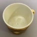 Cup with geometric design and matching saucer.; Crown Lynn Potteries Limited; 1970s; 2016.48.81