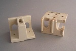 Two electrical fittings; Crown Lynn Technical Ceramics Limited; 1970-1989; 2009.1.1754.1-2