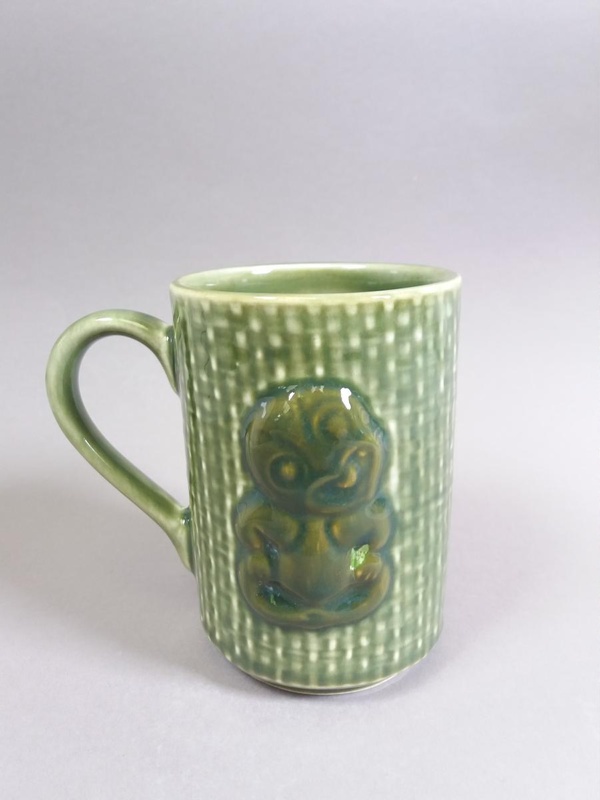 Mug - Hei-Tiki; Studio Ceramics NZ Ltd; 2007; 2017.1.102