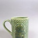 Mug - Hei-Tiki; Studio Ceramics NZ Ltd; 2007; 2017.1.102