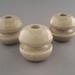 Bobbin insulators; Crown Lynn Technical Ceramics Limited; 1930-1965; 2009.1.1302.1-3