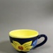 Cup - yellow flowers; Studio Ceramics NZ Ltd; 1991-1995; 2017.1.79