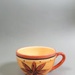 Cup - red flower; Studio Ceramics NZ Ltd; 1998-2004; 2017.1.72