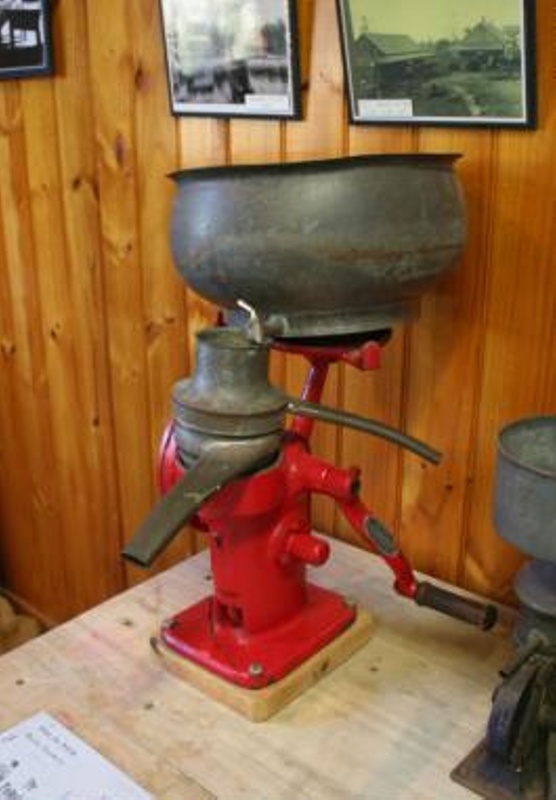 Cream Separator, painted red cast iron body, no base, hand operated, made by R. eHive