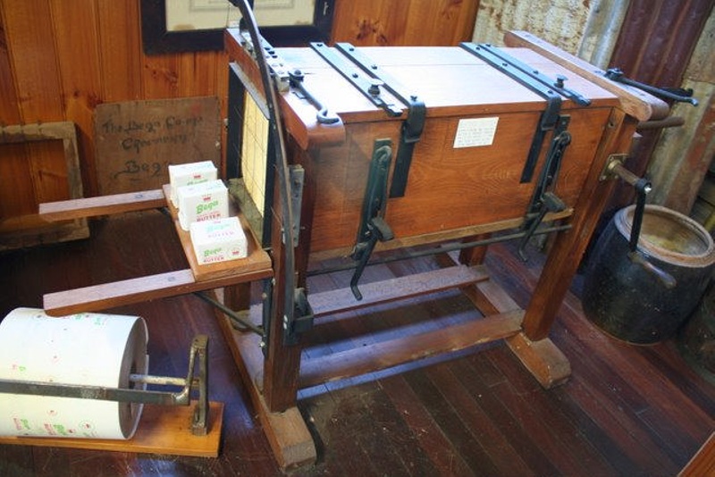 Butter Cutter, wood, cast iron and steel wire, used to cut one pound