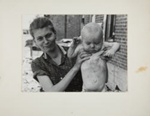 Untitled [Woman holding up baby.]; Brosan, Robert; 1968; 2000:0114: 0001