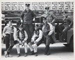 [Untitled, Seven firemen sitting on their firetruck]. ; Harris, Pamela; c.a. 1975; 1977:0101:9999