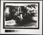 [Untitled, woman playing piano in tropical themed room]; Wells, Alice; ca. 1970; 1988:0026:0003