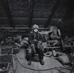 [Child in dirty attic-- surrounded by junk].; Newton, Neil; c.a. 1972; 1974:0015:0016