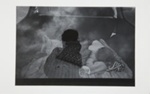 [Child sleeping in the back of a vehicle]; Fichter, Robert; ca. 1960-1970; 1972:0258:0001