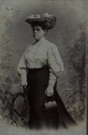  [Studio portrait of a woman wearing an elaborate hat and holding a small purse.]; Karl Riss; 1905; 1981:0053:0101
