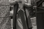 [close cropped view of woman holding stack of papers]; Tsuchida, Hiromi; 1983; 1993:0005:0015