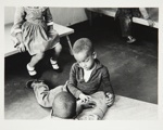 [Untitled, two boys play on floor of nursery, and a little girl and boy sit on benches]. ; Heron, Reginald; 1966; 1972:0161:9999