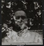 Untitled [Portrait of Ralph Eugene Meatyard through broken glass.]; Ritchie, Cranston; ca. 1960