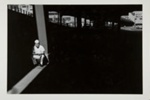 [Man seated beneath a bridge]; Uzzle, Burk; 1979:0044:0001