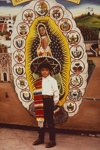 Young Pilgrim In Front of Backdrop By the Late Jacinto Rojas, Shrine of Guadalupe; Oettinger, Marion; 1989; 2009:0058:0007