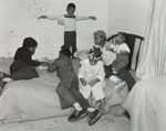 [Children on a Bed with a Puzzle]; Crescenzi, Christine; 2000:0098:0001
