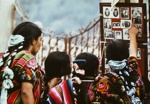 Young Women Studying Photographer's Display Board, Chichicastenango, Guatemala; Parker, Ann; 1972; 2009:0056:0022 Young Women Studying Photographer's Display Board, Chichicastenango, Guatemala; Parker, Ann; 1972; 2009:0056:0022