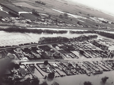 Photograph [1978 Flood, aerial view north end of Main and Kana Streets, Mataura]; Henderson, Keith Raymond; 1973; MT2017.18.15