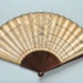 Wooden folding fan with printed paper leaf - Fanology 1797; LDFAN2014.162