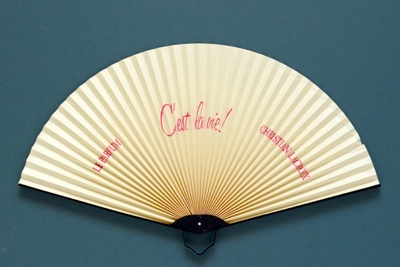 Half-cockade fan advertising C'est la Vie perfume for Christian Lacroix; 1990; LDFAN2006.7