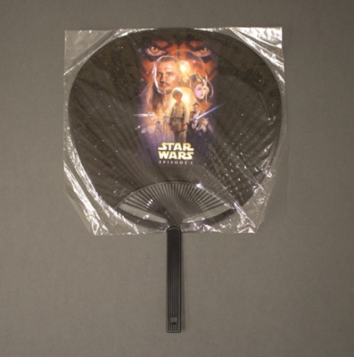 Fixed fan advertising 'Star Wars' inside its original clear plastic wrapper; 20th century; LDFAN2021.1