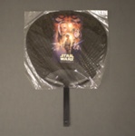 Fixed fan advertising 'Star Wars' inside its original clear plastic wrapper; 20th century; LDFAN2021.1