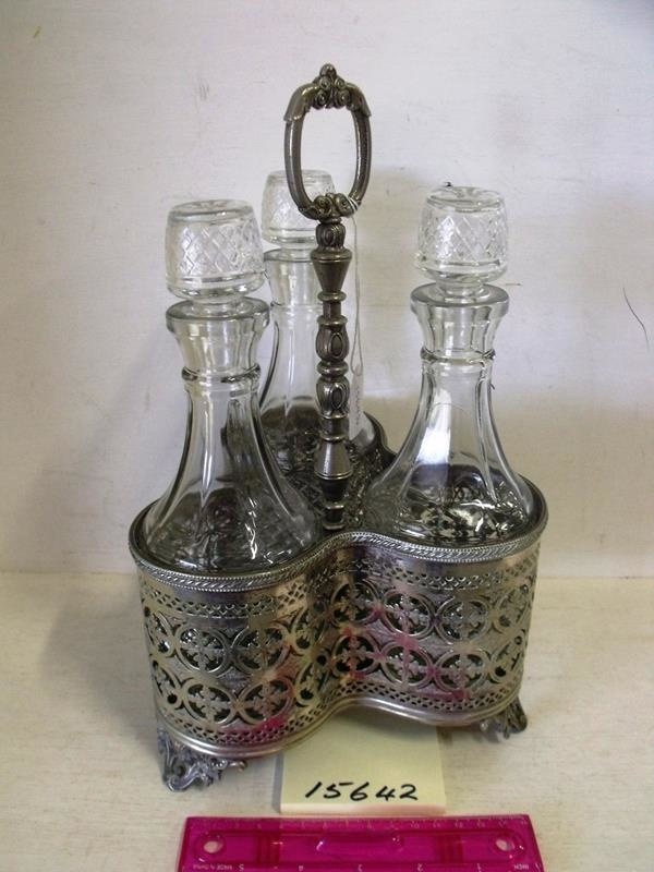 Three decanter set in silver holder; R15642 eHive