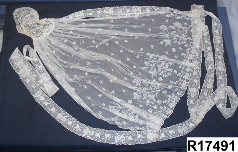 A cream lace wedding veil.; R17491 eHive