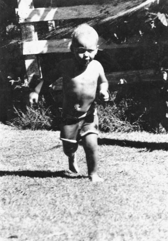 Photograph of a young boy (Graham Ramsay Jnr.) in the garden of the ...