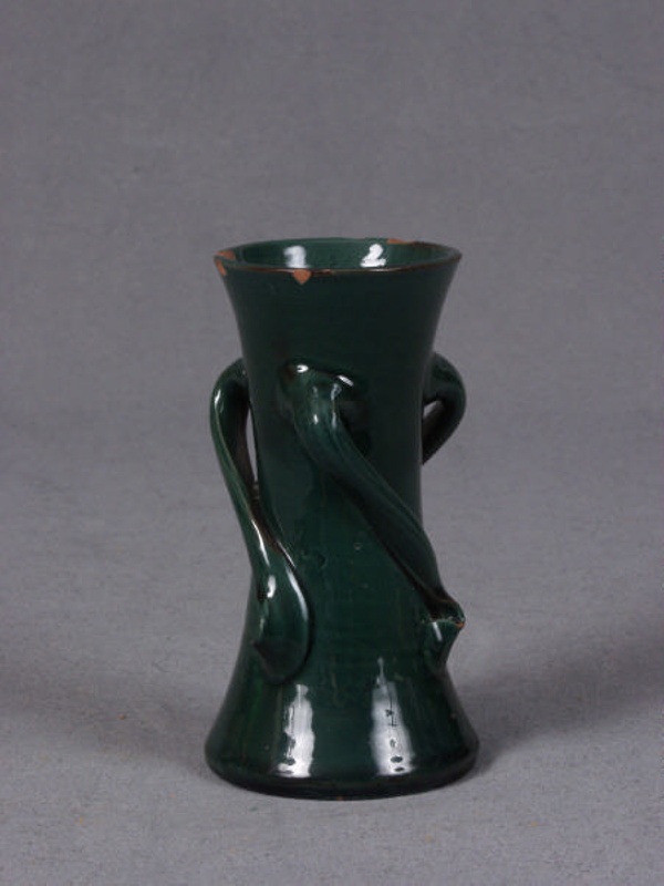Small dark green waisted cylindrical vase with swirl handles
