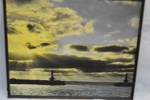 photograph of an atmospheric sunrise over Lowestoft Harbour; LOWMS:2023.155