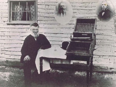 William Tom jr. (c1890) with the gold cradle that he made in 1851. Image courtesy Powerhouse Museum