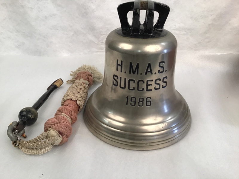 HMAS Success (1986) ships bell, clapper and bell rope, bell stand for