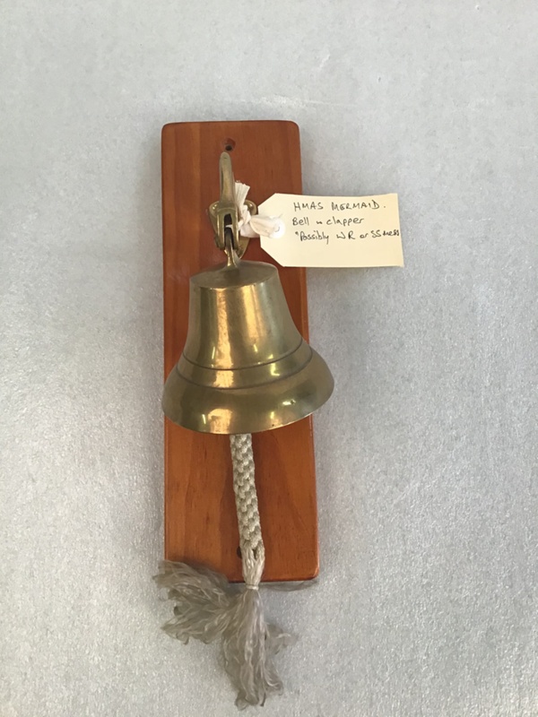 Ship’s Bell, Rope and Clapper mounted on wooden backing; HMAS Mermaid
