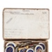Cardboard box with 30 metal badges - ARP, AFS, REST CENTRE, and RNLI; CRMCH.1995.02