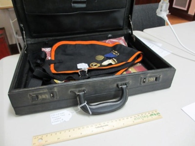 Attache case holding Star of Orange items; OB210262