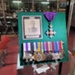 Display Board with Col. A.E. Colvin Photograph and Medals ; OWM2015/246:1-12