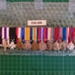 Display Board with Col. A.E. Colvin Photograph and Medals ; OWM2015/246:1-12