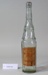 Tall fluted clear glass bottle.; Champion & Co; Unknown; CR2007.043 