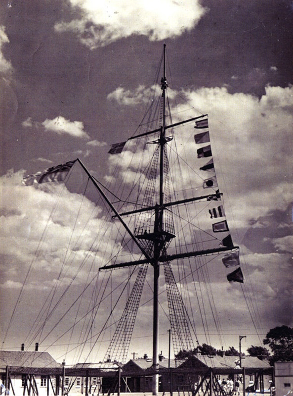 Photograph of the HMS Ganges mast dressed overall in 1952; photographer ...